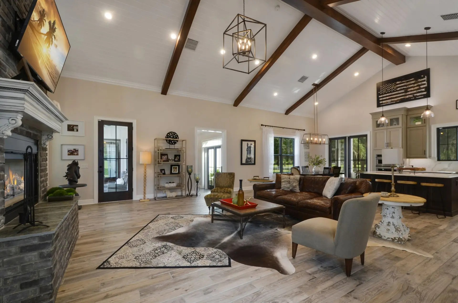 Custom home living room with tall ceilings and wood beams