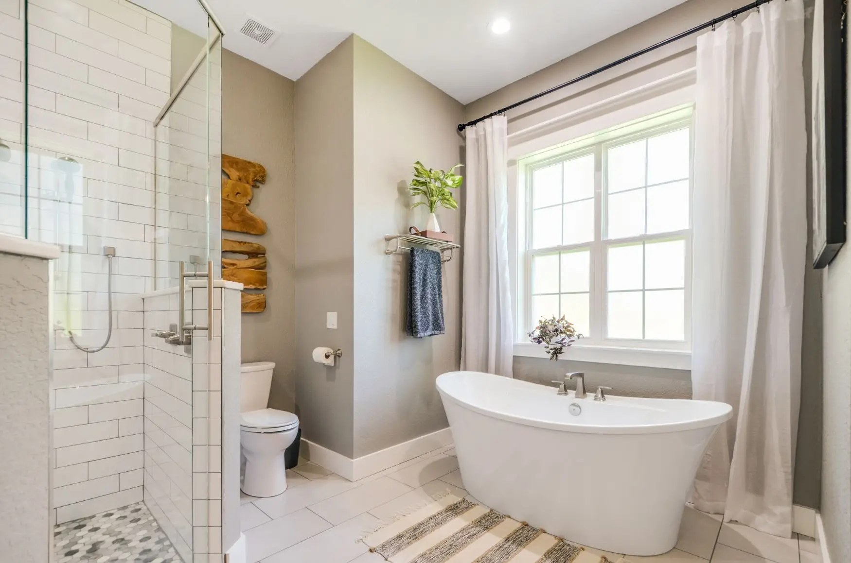 Finished bathroom with a freestanding bathtub