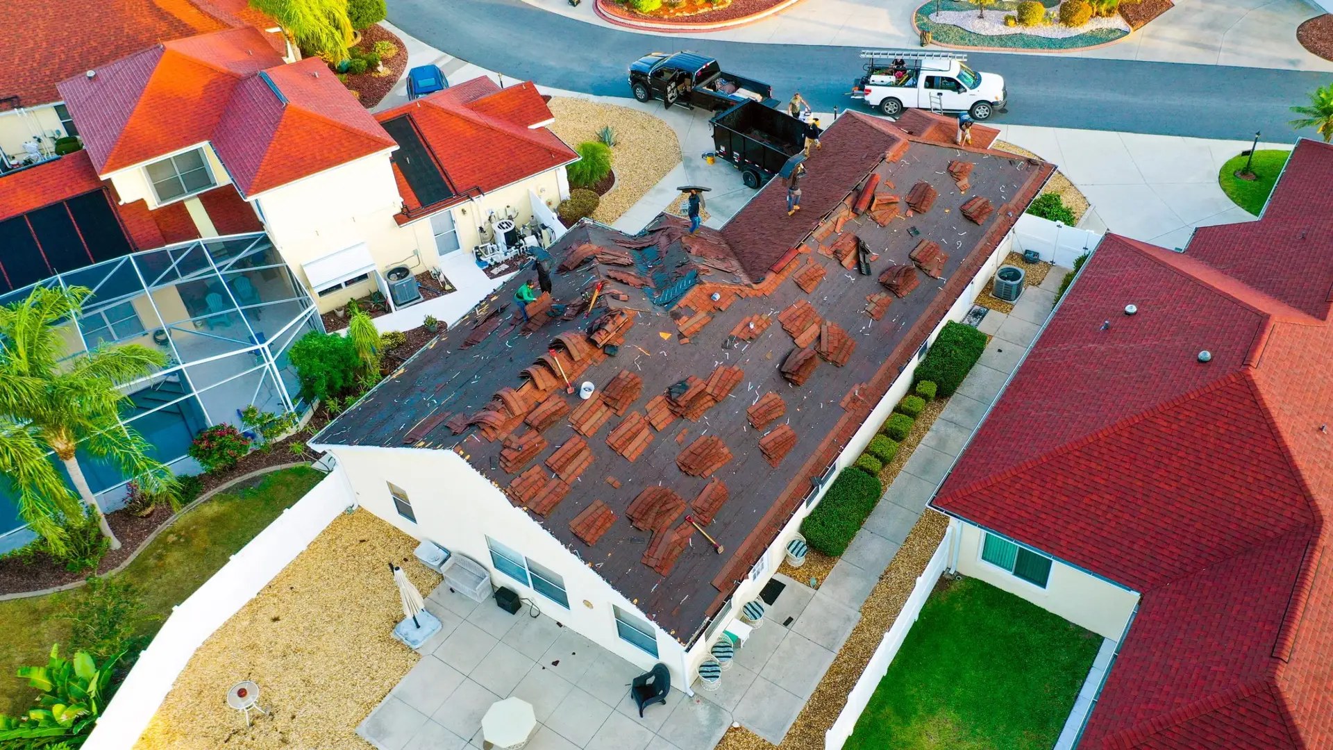 Aerial view of a roof replacement with exposed decking