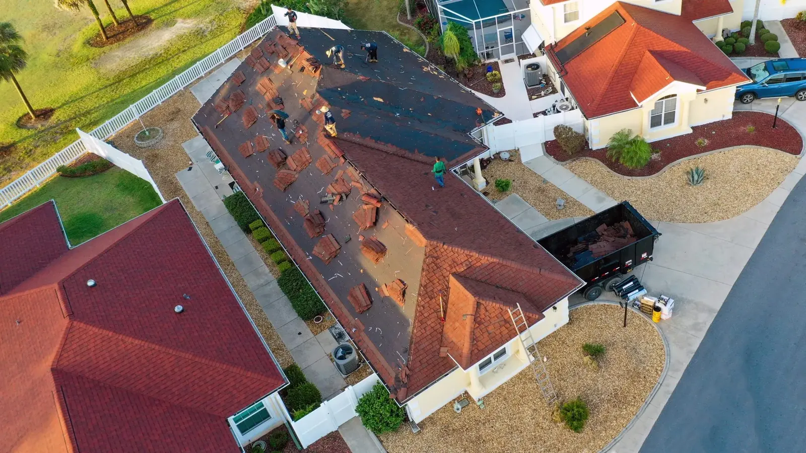 Aerial view of old roofing stripped from a home during a roof replacement