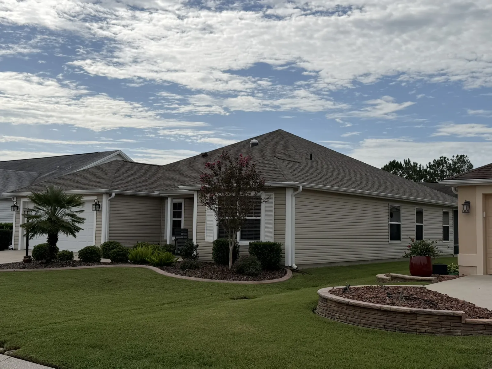 Finished dark gray shingle roof on a single-story Central Florida home
